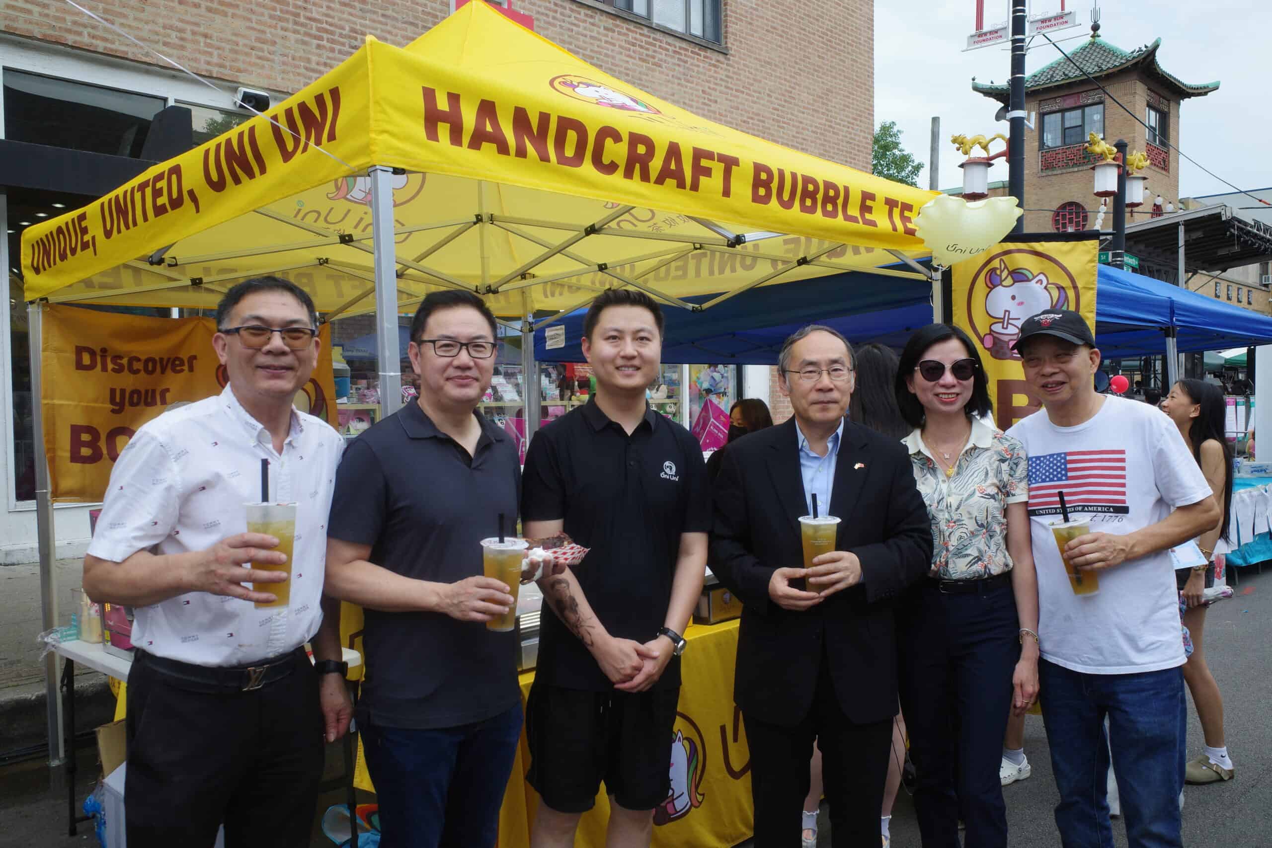 Group enjoying bubble tea at festival