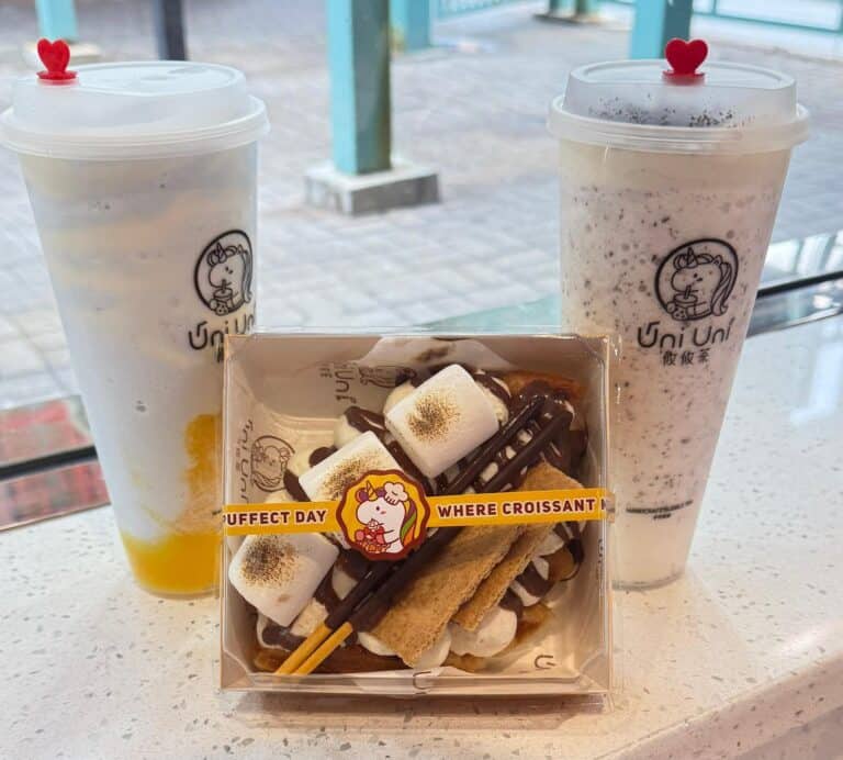 Two boba drinks and a dessert with marshmallows and chocolate.